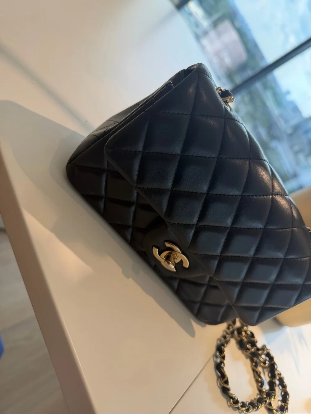 CHANEL Black Quilted Lambskin Mini Flap Bag with Gold Hardware